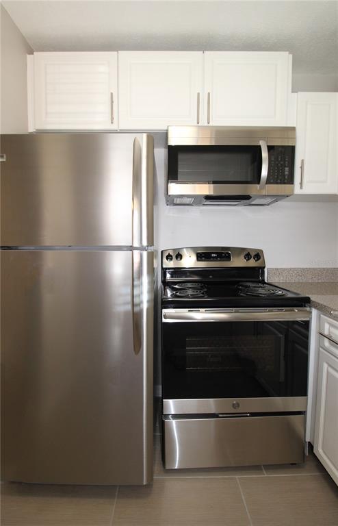 3001 Bee Ridge Road, Unit 121 Sarasota, FL 34239 - Photo 2 of 19 a view of kitchen with stainless steel appliances and cabinets