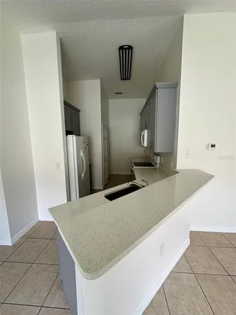 a view of a kitchen with a sink