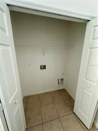 a view of a room with wooden floor and cabinet