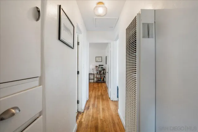 a bedroom with a bed and a desk