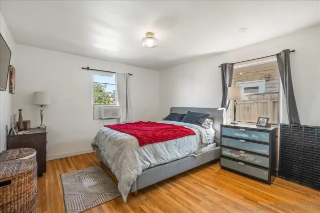 a bedroom with a large bed and a closet