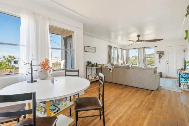 a workspace with furniture window and wooden floor