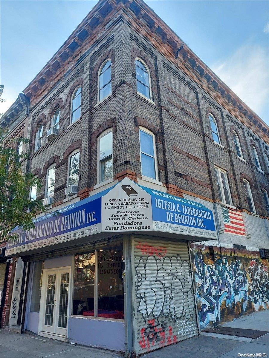 a view of a building with retail shops