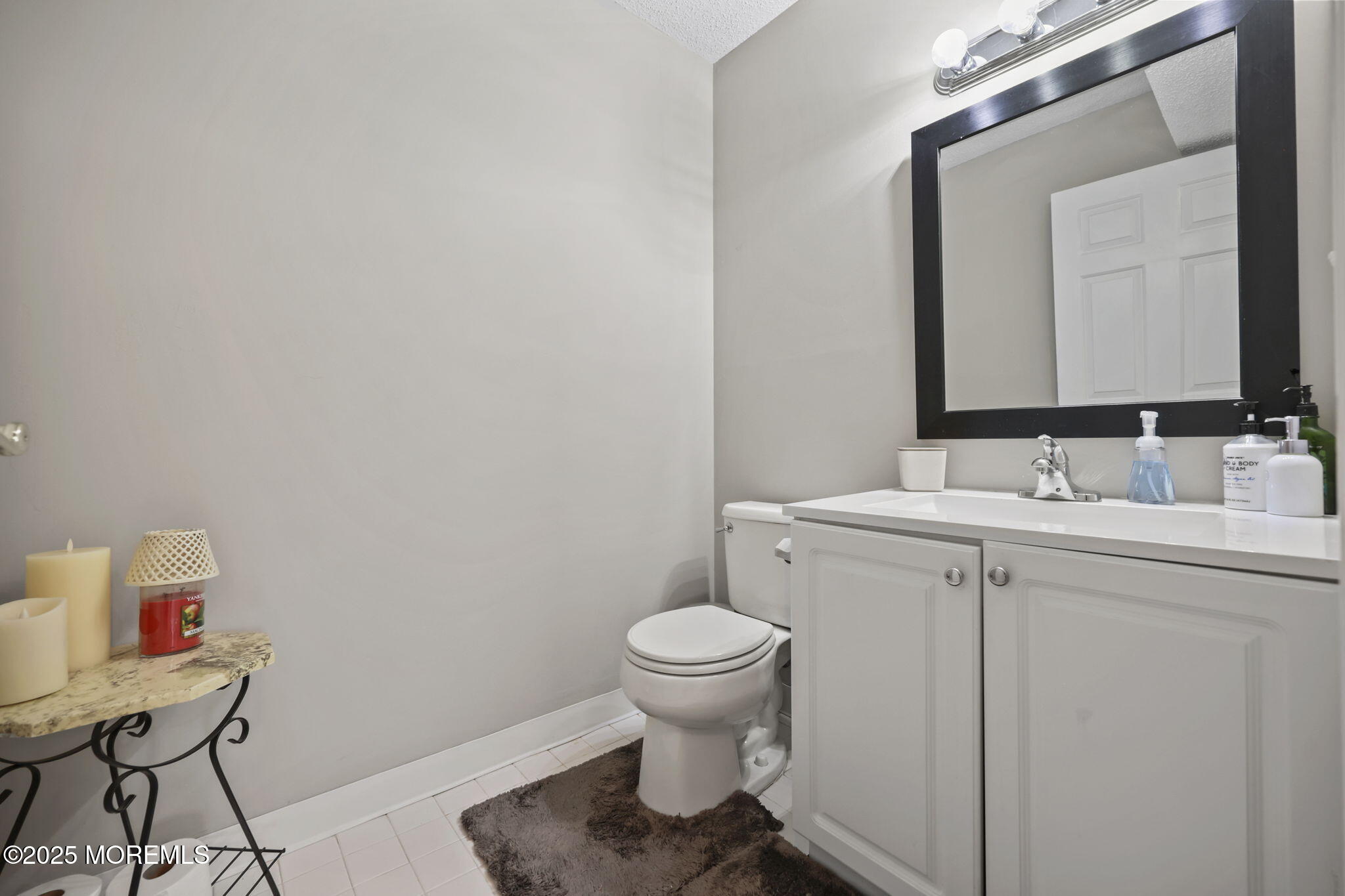 2 Madison Court Tinton Falls, NJ 07712 - Photo 11 of 22 a bathroom with a toilet sink and mirror