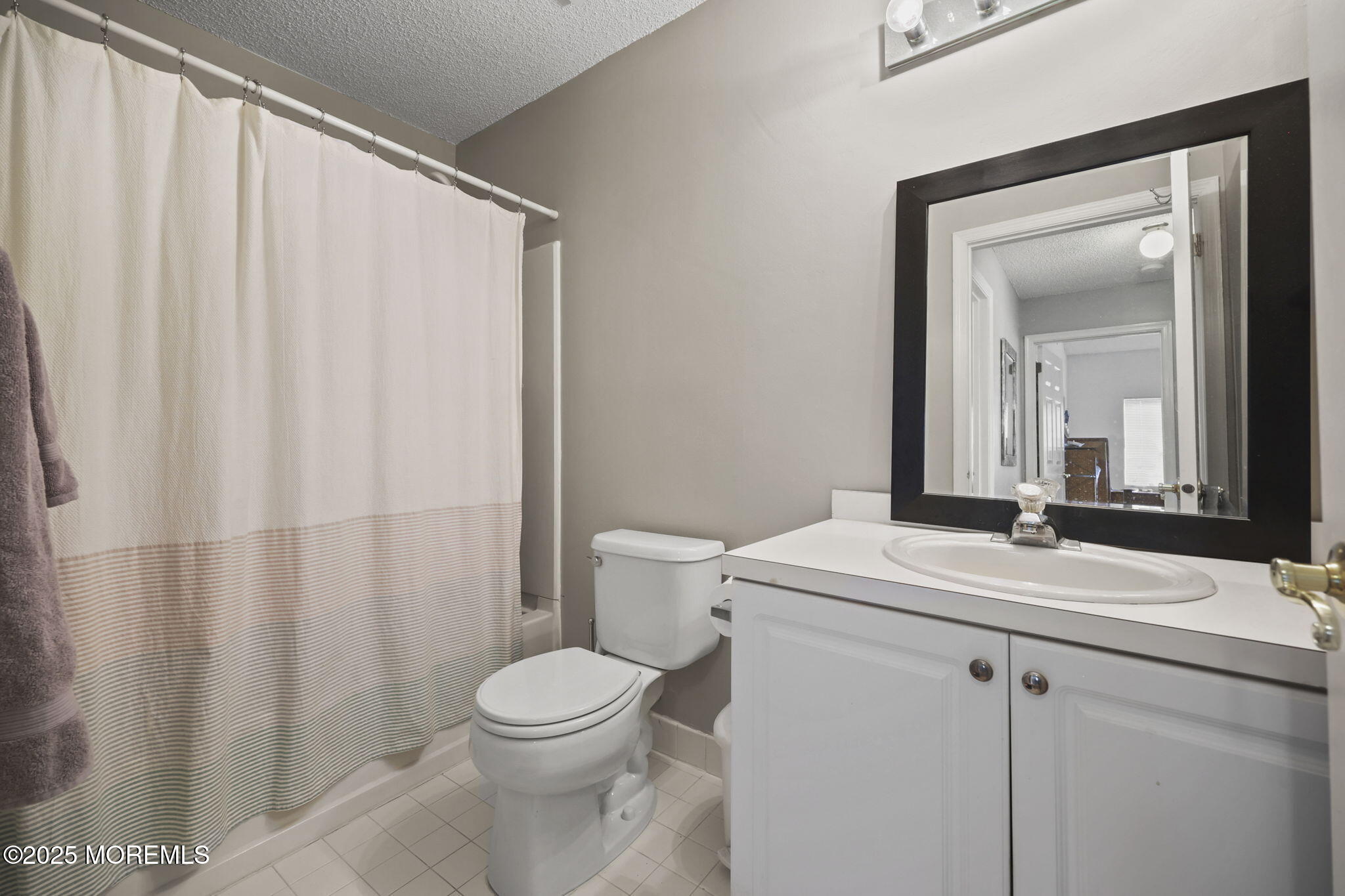 2 Madison Court Tinton Falls, NJ 07712 - Photo 14 of 22 a bathroom with a sink a toilet and a mirror