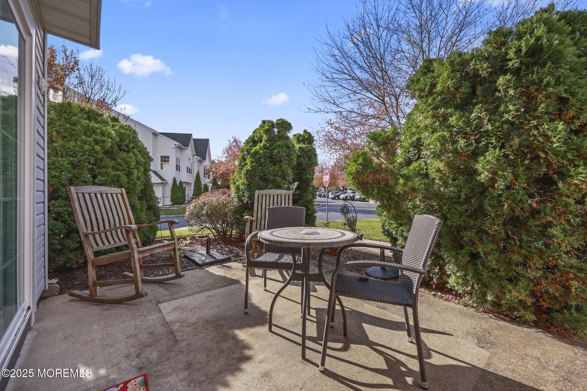 2 Madison Court Tinton Falls, NJ 07712 - Photo 22 of 22 a view of a patio with table and chairs and potted plants