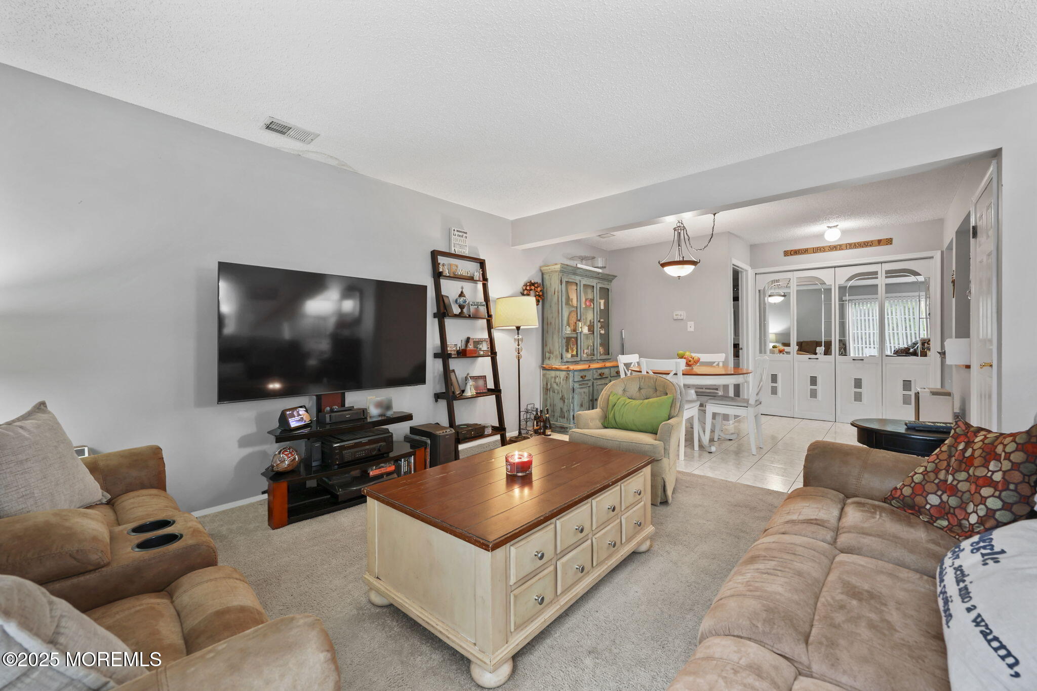 2 Madison Court Tinton Falls, NJ 07712 - Photo 5 of 22 a living room with furniture and a flat screen tv