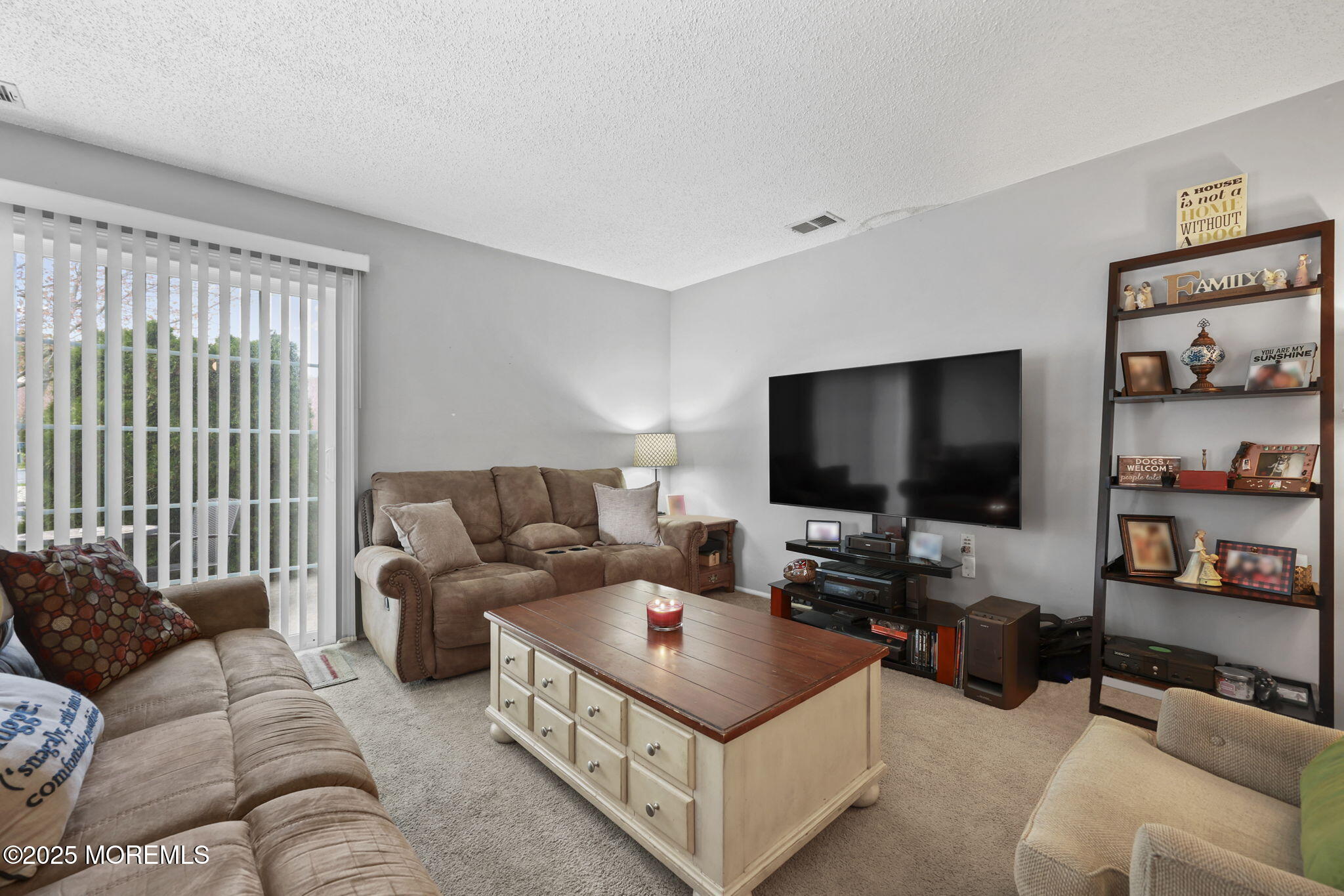 2 Madison Court Tinton Falls, NJ 07712 - Photo 6 of 22 a living room with furniture and a flat screen tv