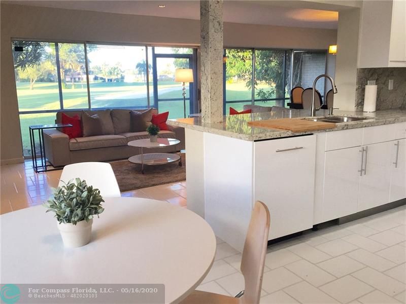Kitchen/Living Room with massive golf views - double fairway and a canal