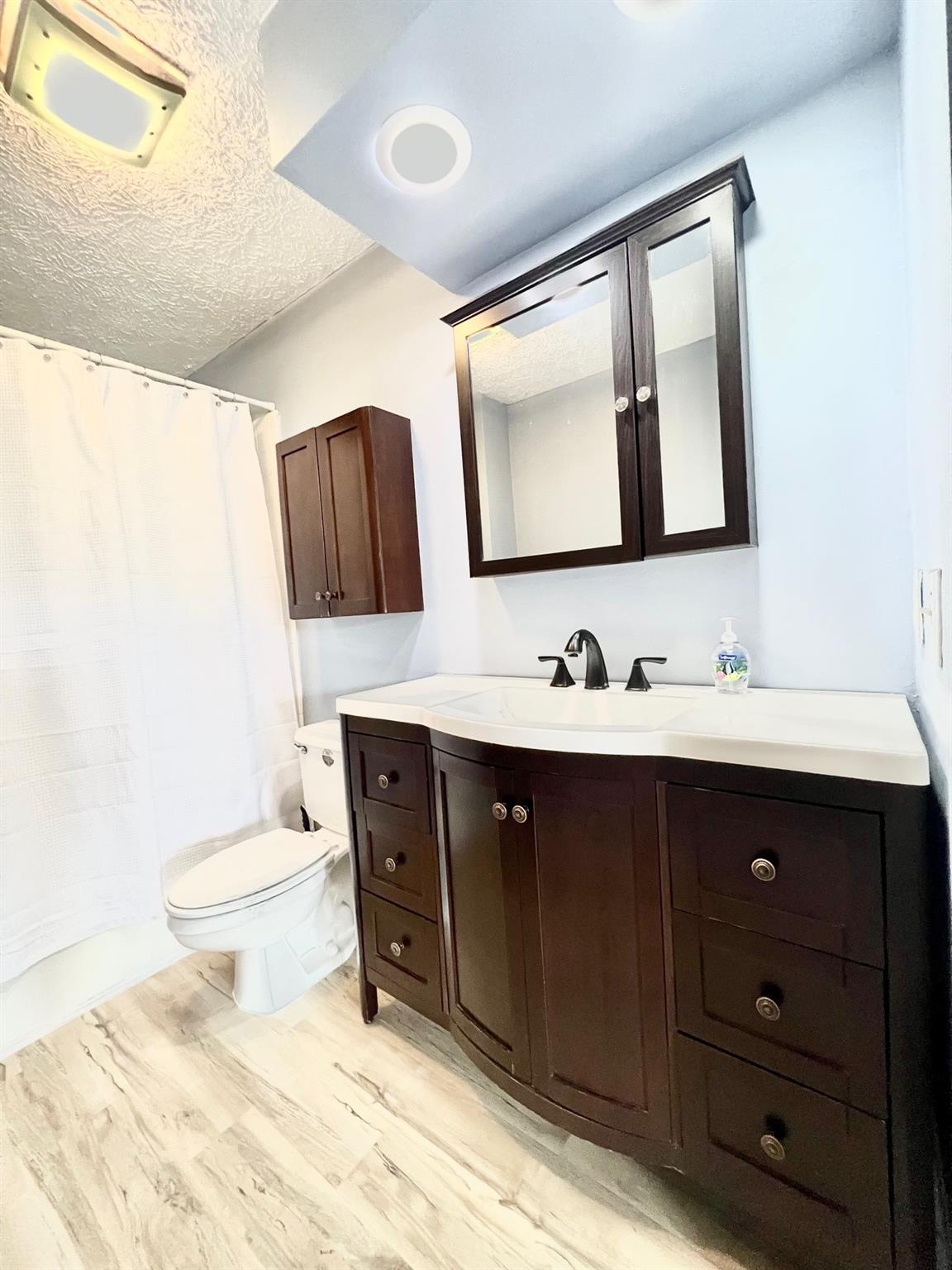 2245 Huckleberry Ridge Road Hiddenite, NC 28636 - Photo 4 of 13 a bathroom with a sink vanity and a mirror