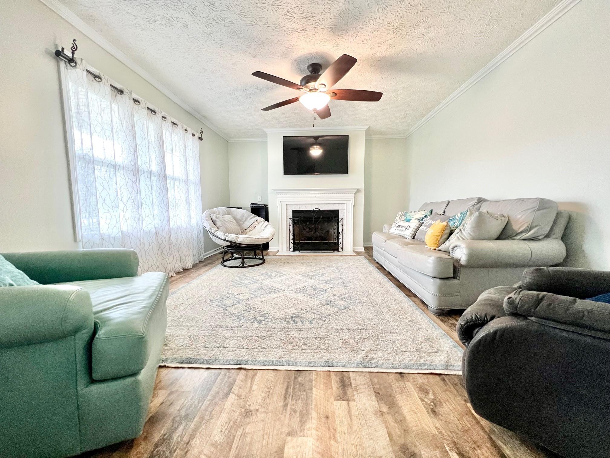 2245 Huckleberry Ridge Road Hiddenite, NC 28636 - Photo 10 of 13 a living room with furniture fireplace and window