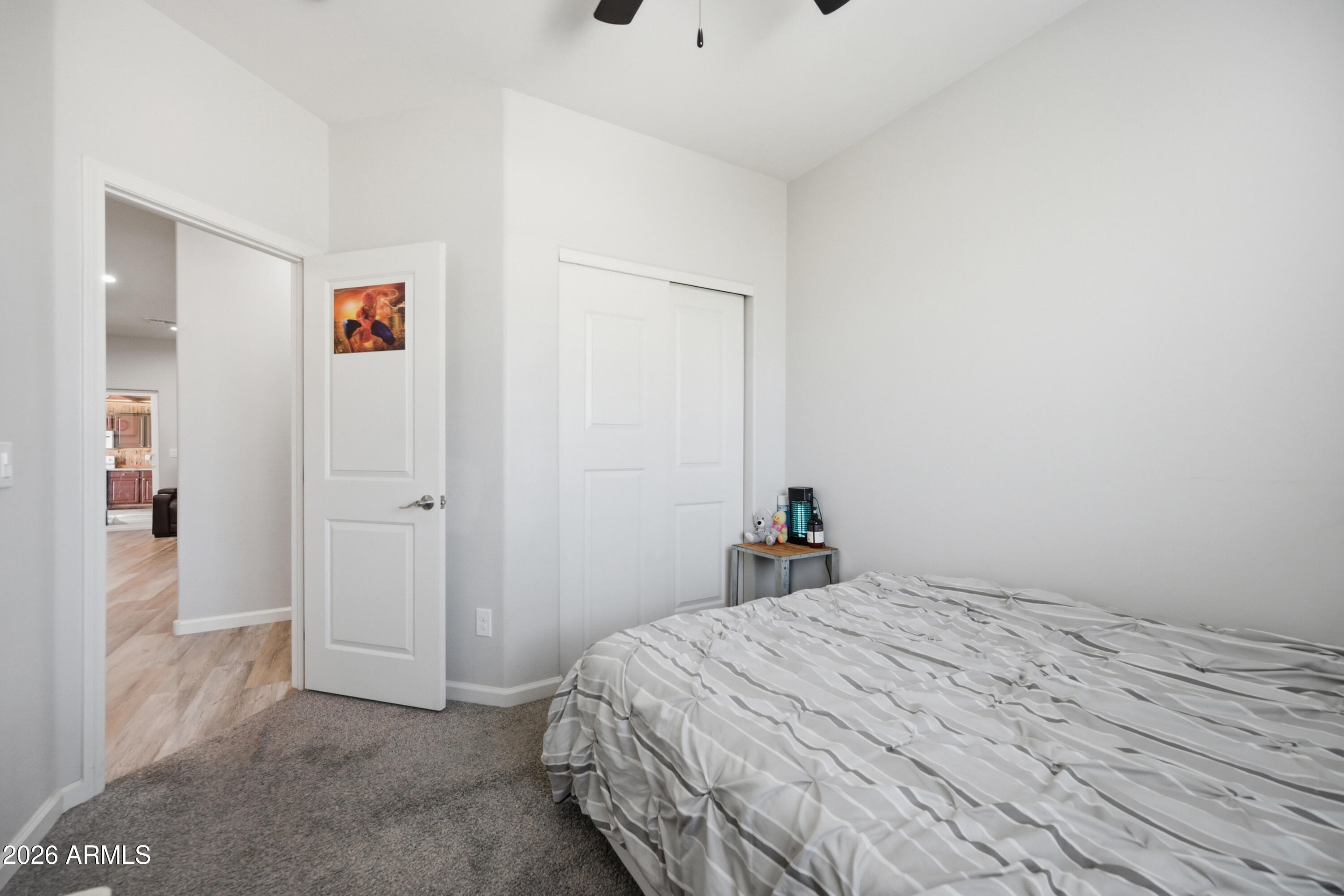 10547 East Baltimore Street Apache Junction, AZ 85120 - Photo 17 of 43 a bedroom with a bed and a window
