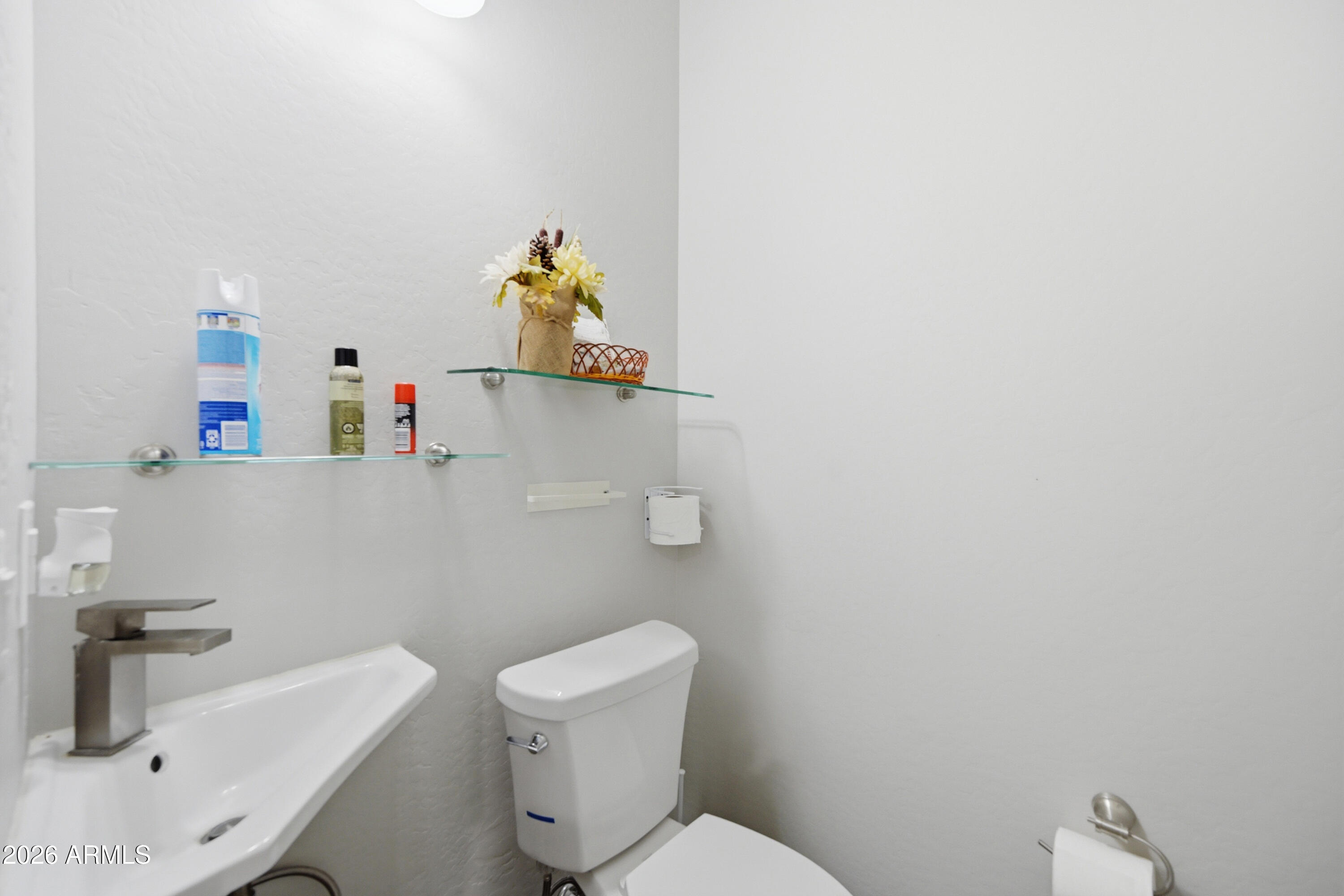 10547 East Baltimore Street Apache Junction, AZ 85120 - Photo 25 of 43 a bathroom with a sink a toilet and vanity