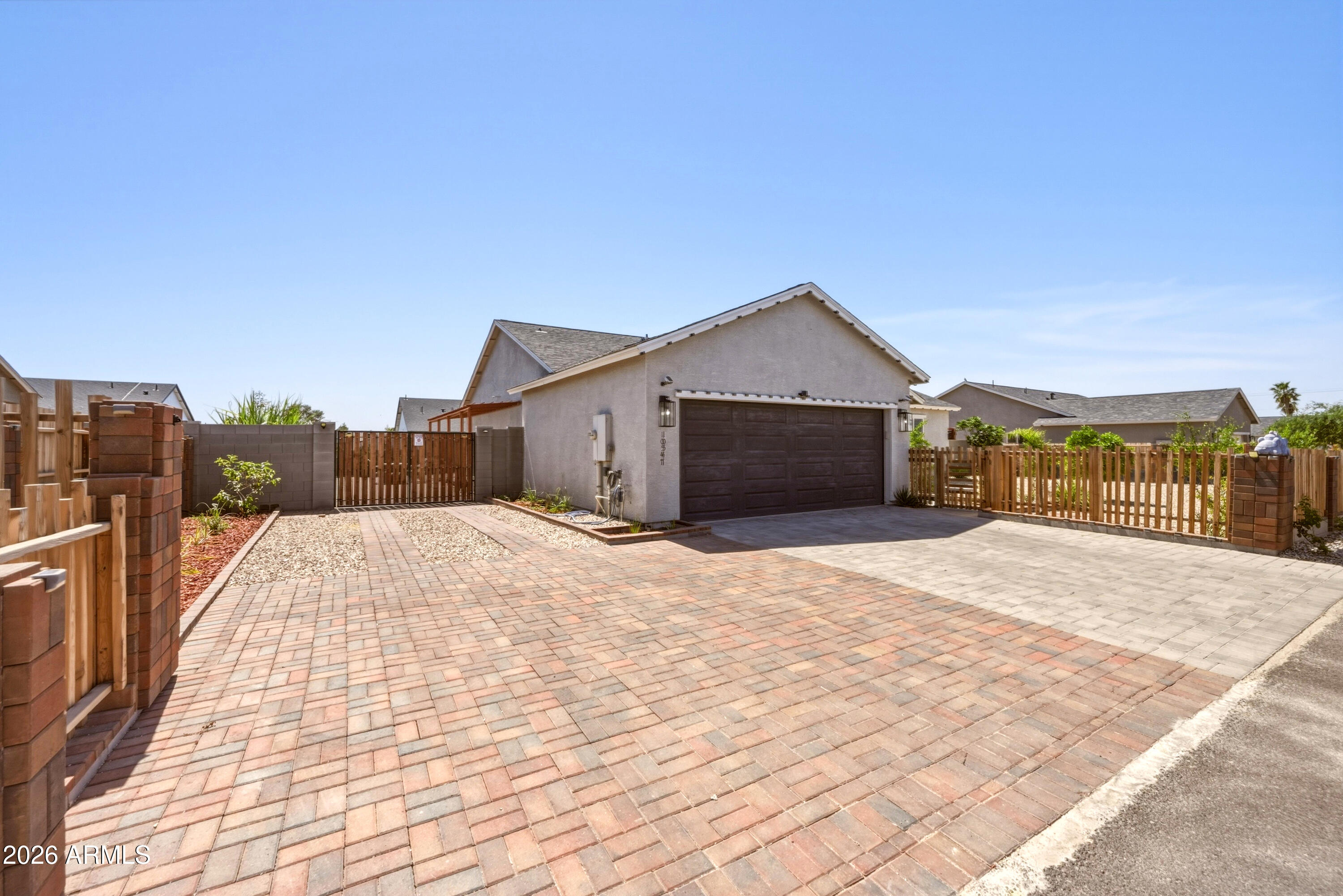 10547 East Baltimore Street Apache Junction, AZ 85120 - Photo 3 of 43 a front view of a house with a yard
