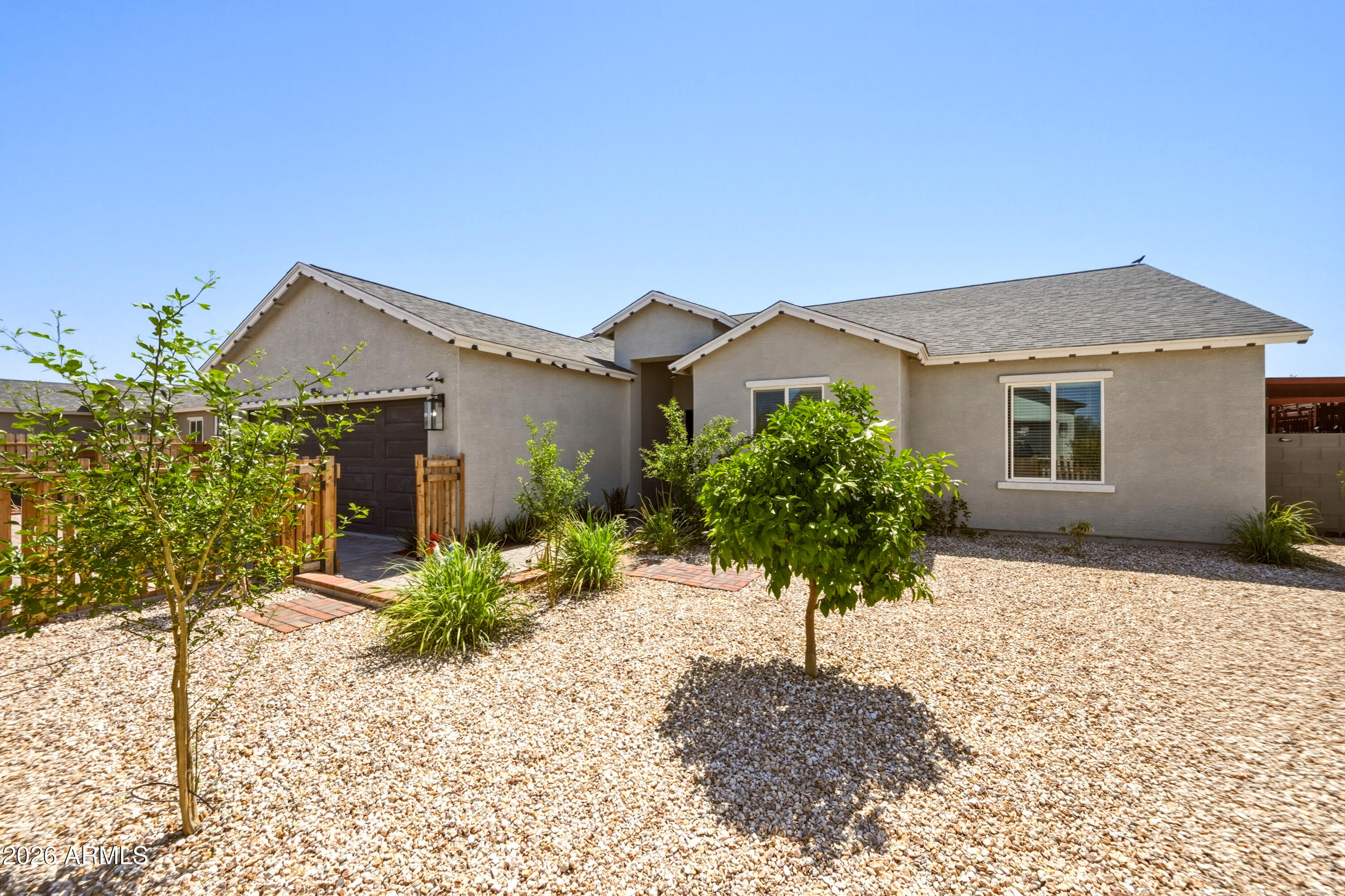 10547 East Baltimore Street Apache Junction, AZ 85120 - Photo 5 of 43 a front view of a house with a yard