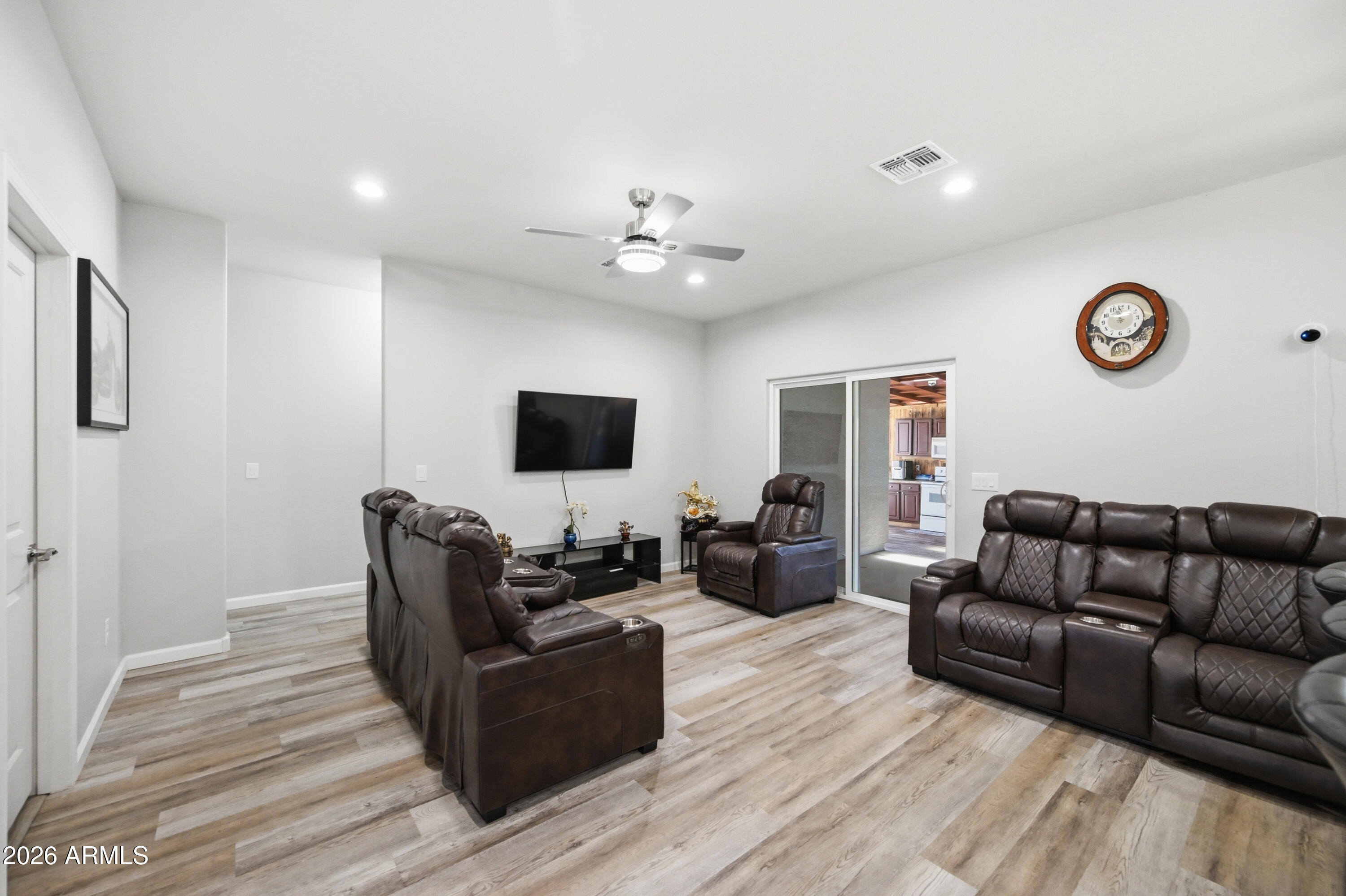 10547 East Baltimore Street Apache Junction, AZ 85120 - Photo 9 of 43 a living room with furniture and a flat screen tv