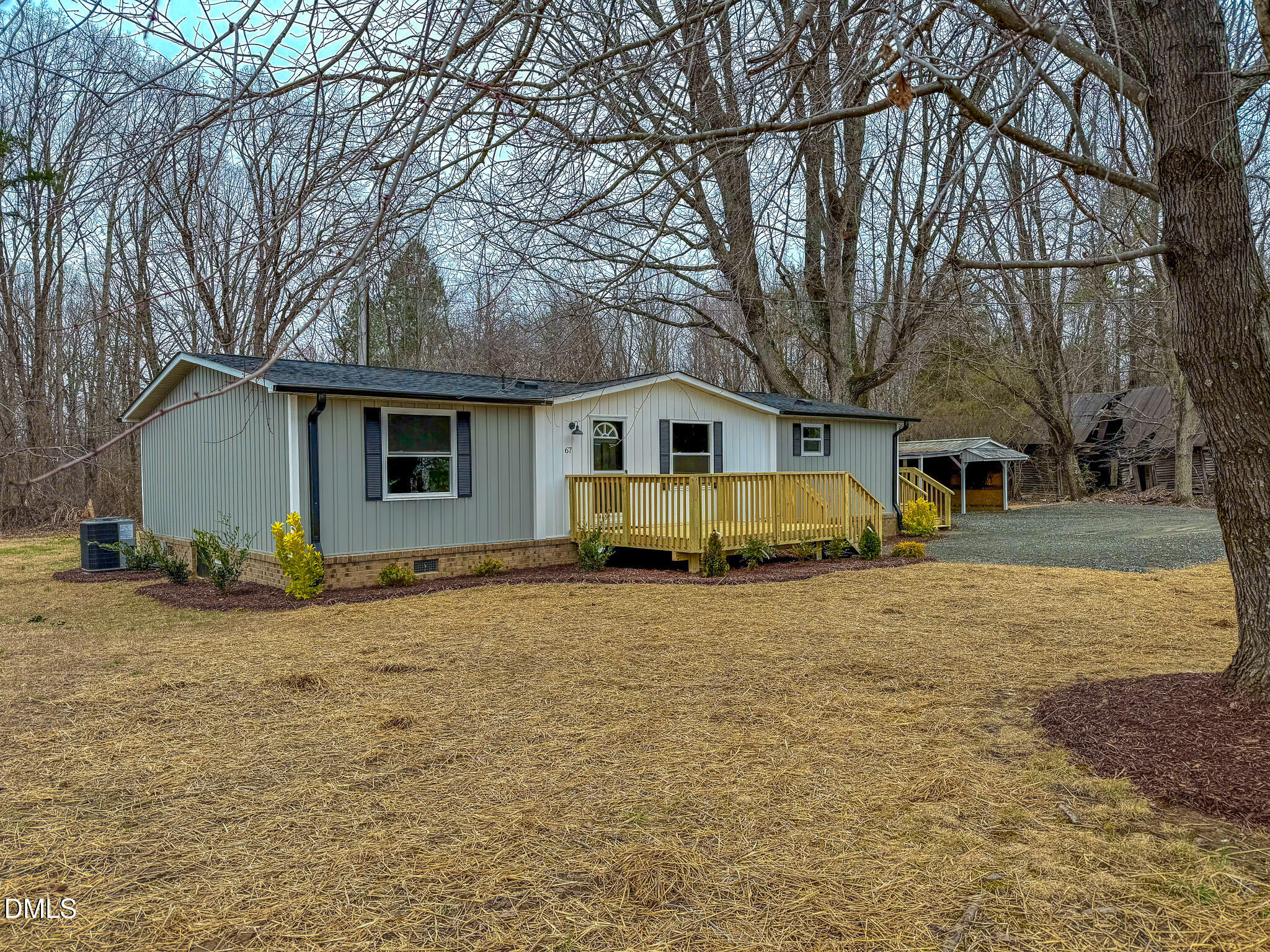 67 Halifax Road Roxboro, NC 27574 - Photo 29 of 48 a view of a house with a yard covered in snow