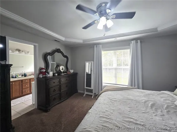 a bed room with a bed and a television