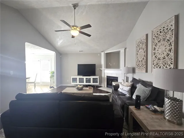 a bedroom with a bed window and couch