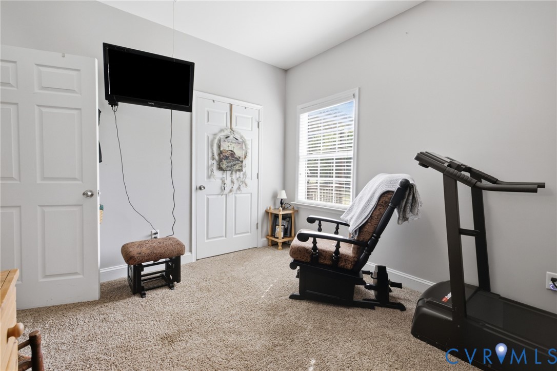 9433 Robin Road Disputanta, VA 23842 - Photo 16 of 26 Carpeted room featuring a window with blinds, two