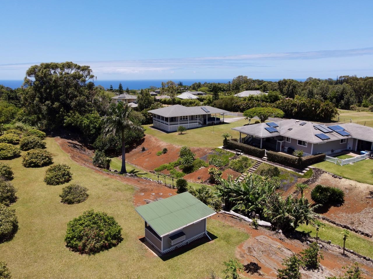 an aerial view of a house with a garden