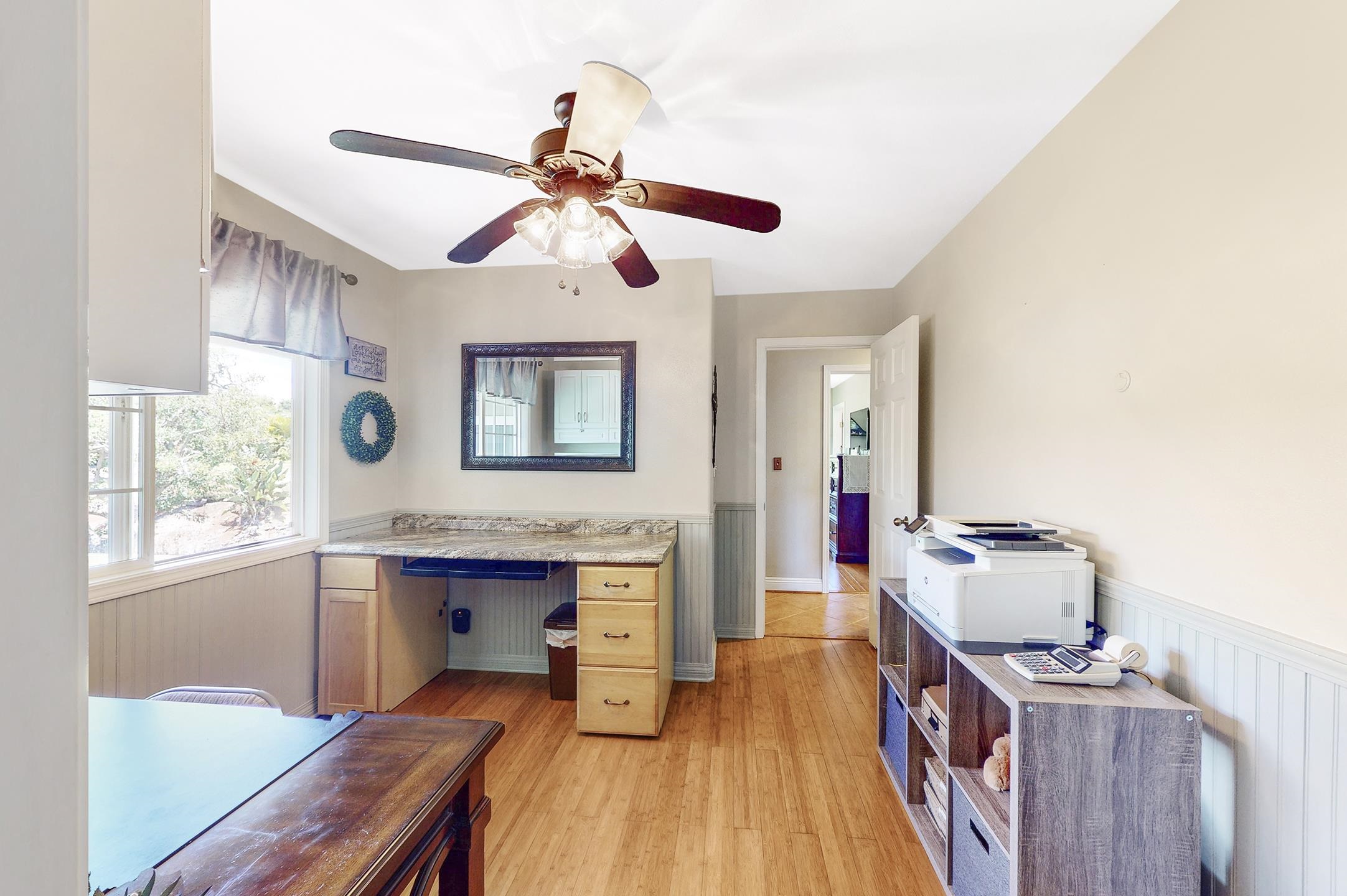 1480 Hog Back Road, Unit 1480 HOG BACK ROAD Haiku, HI 96708 - Photo 11 of 29 a view of a workspace with furniture and a window