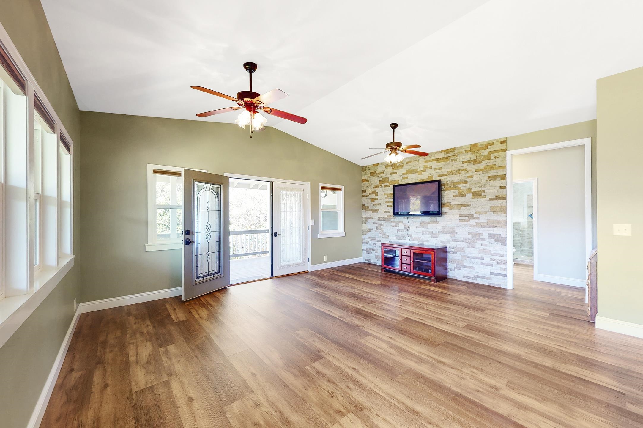 1480 Hog Back Road, Unit 1480 HOG BACK ROAD Haiku, HI 96708 - Photo 18 of 29 a view of an empty room with a window and wooden floor