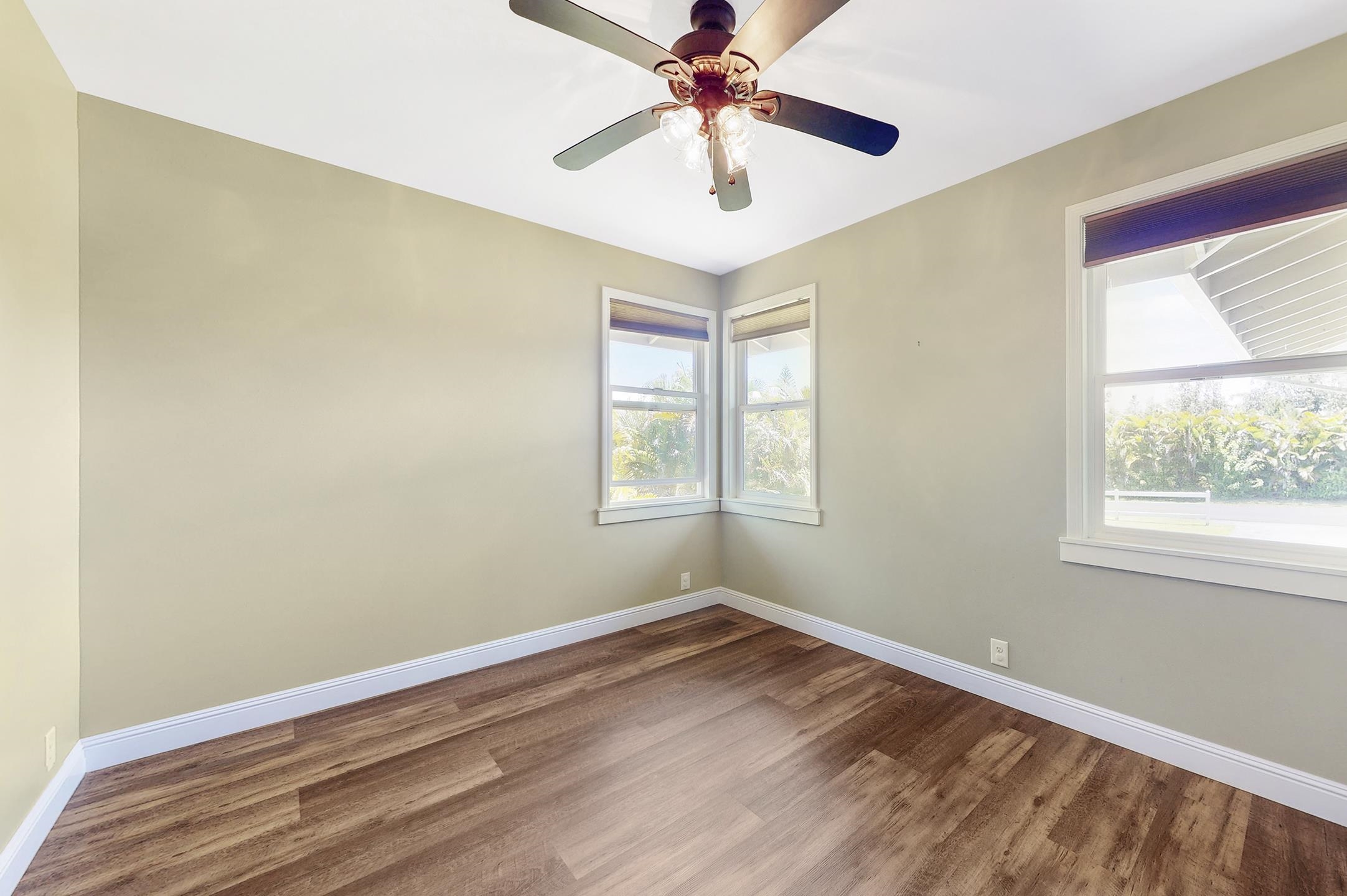 1480 Hog Back Road, Unit 1480 HOG BACK ROAD Haiku, HI 96708 - Photo 22 of 29 a view of a room with wooden floor and a window