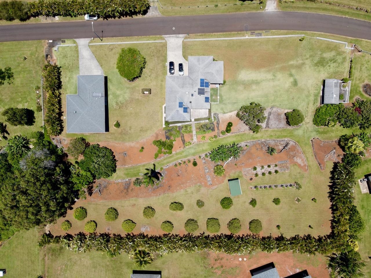 1480 Hog Back Road, Unit 1480 HOG BACK ROAD Haiku, HI 96708 - Photo 24 of 29 an aerial view of a house with a swimming pool