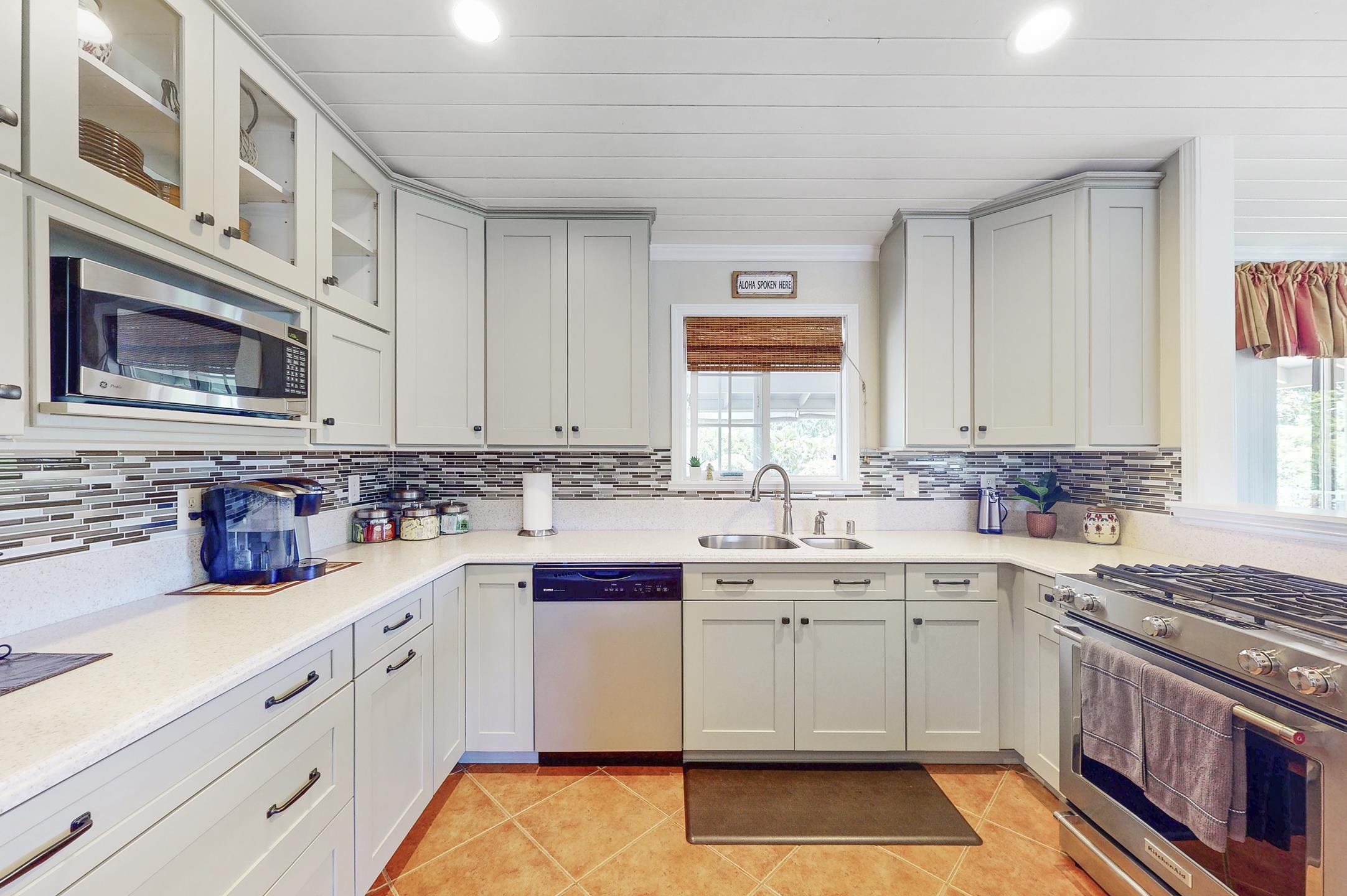 1480 Hog Back Road, Unit 1480 HOG BACK ROAD Haiku, HI 96708 - Photo 4 of 29 a kitchen with a sink stove and cabinets