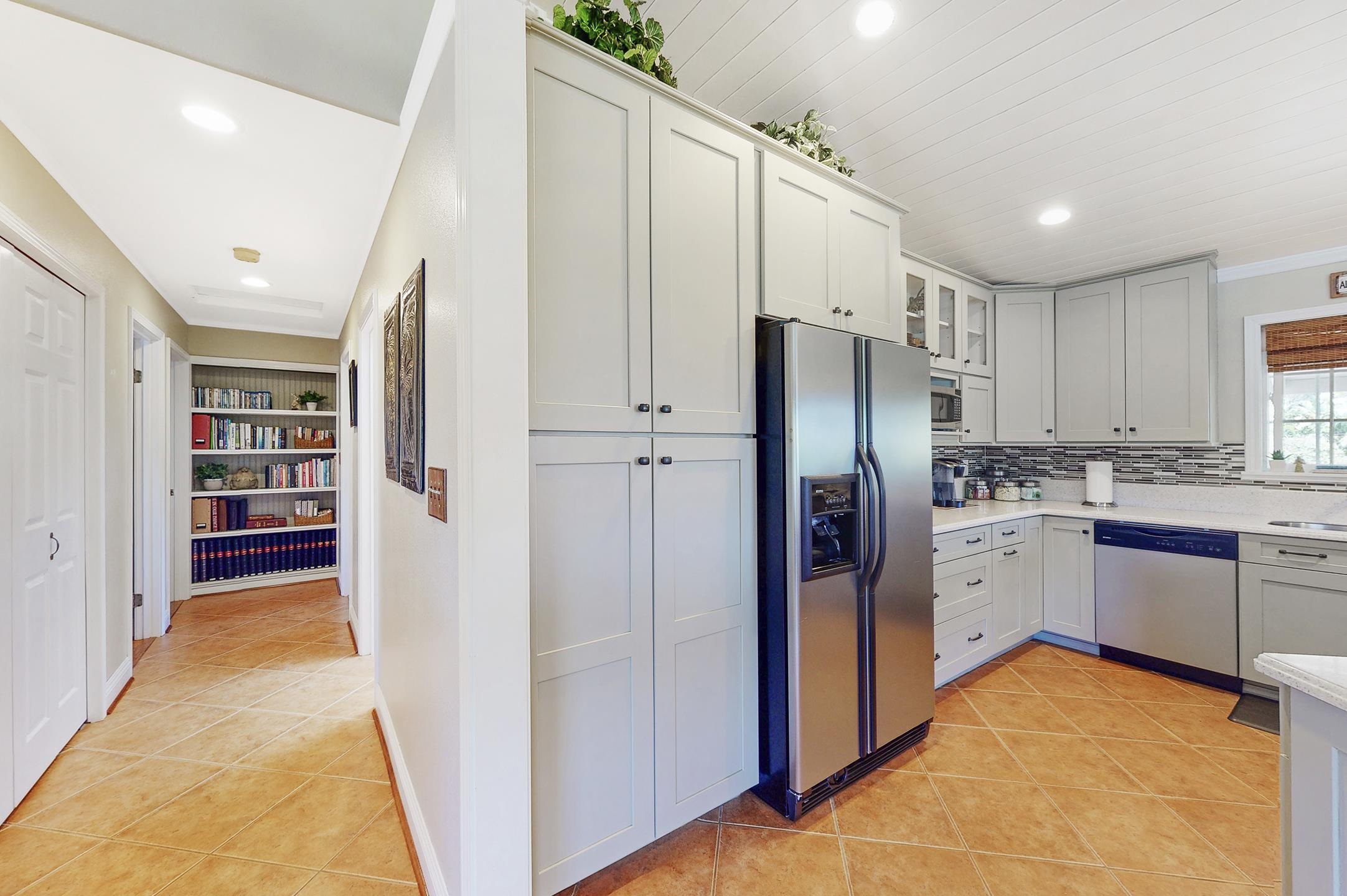1480 Hog Back Road, Unit 1480 HOG BACK ROAD Haiku, HI 96708 - Photo 5 of 29 a kitchen with stainless steel appliances a refrigerator sink and cabinets