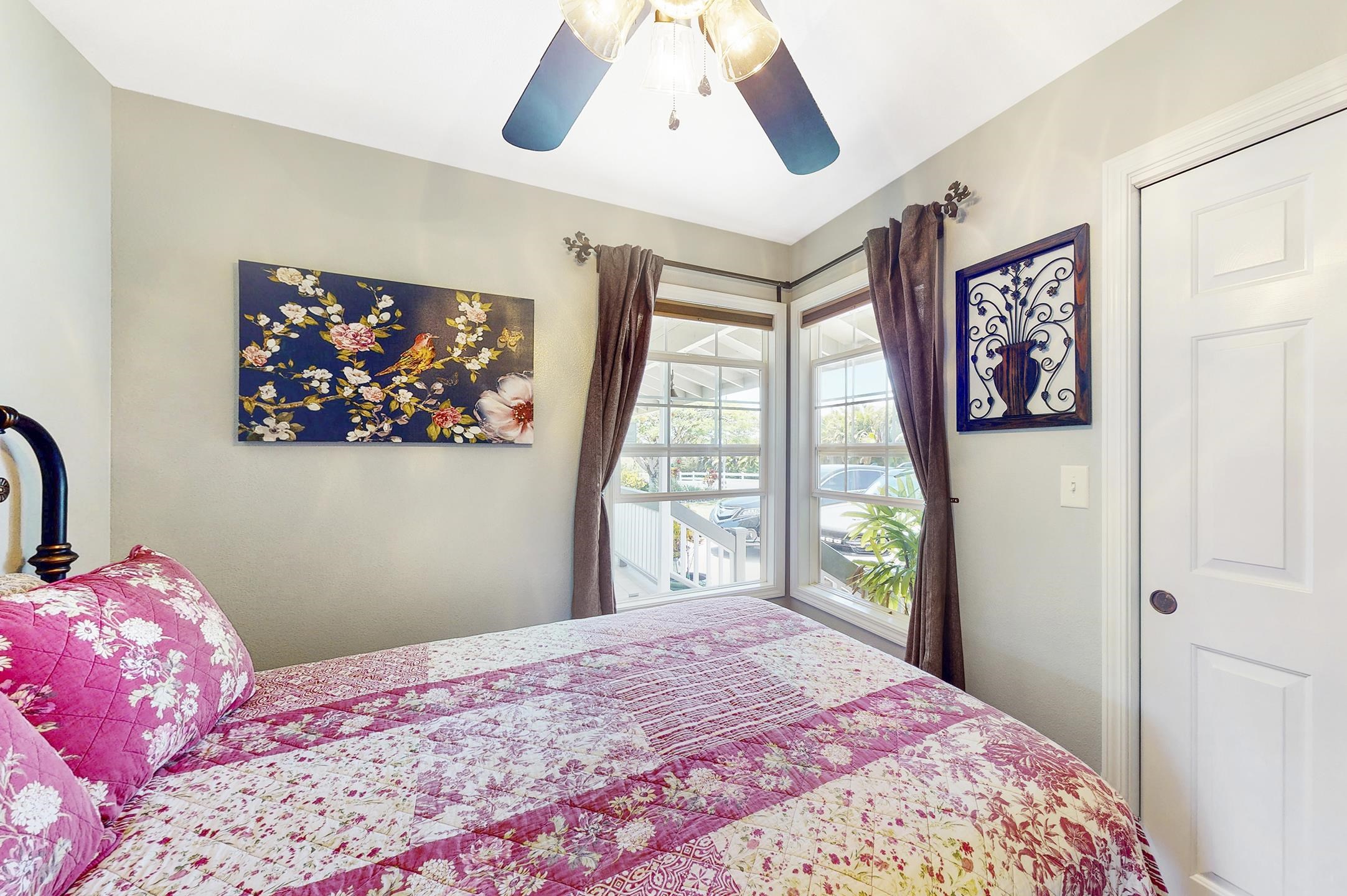 1480 Hog Back Road, Unit 1480 HOG BACK ROAD Haiku, HI 96708 - Photo 10 of 29 a bedroom with a large bed and a large window