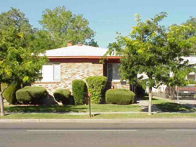 915-917 South Arlington Reno Nv Reno, NV 89509 - Photo 1 of 1 a view of backyard with barn and large trees