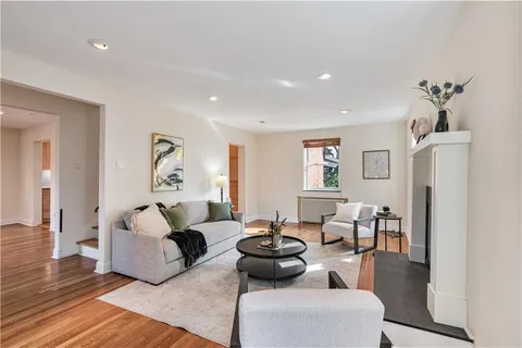 a living room with furniture and a table