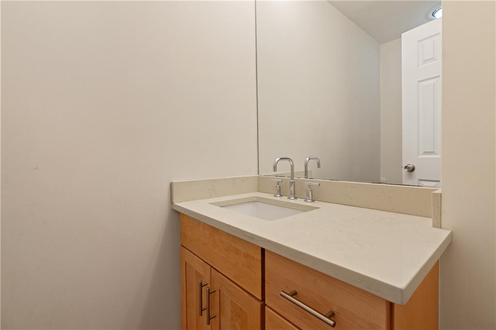 943 Wellesley Road Pittsburgh, PA 15206 - Photo 23 of 34 a bathroom with a sink and a mirror