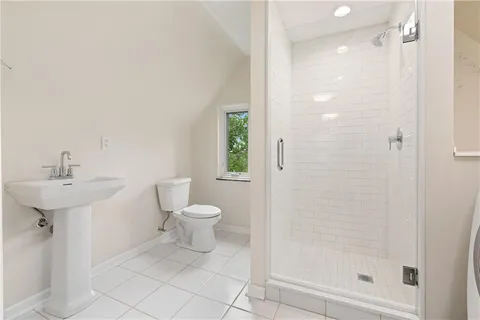 an aerial view of a house with a yard basket ball court and outdoor seating