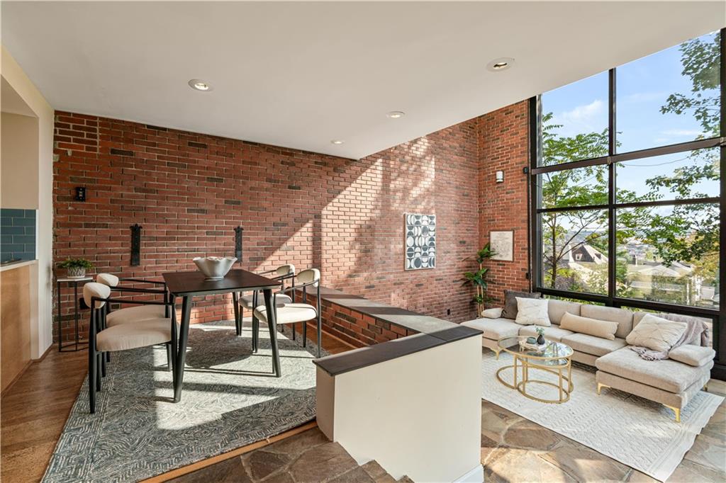 943 Wellesley Road Pittsburgh, PA 15206 - Photo 5 of 34 a living room with furniture and a large window