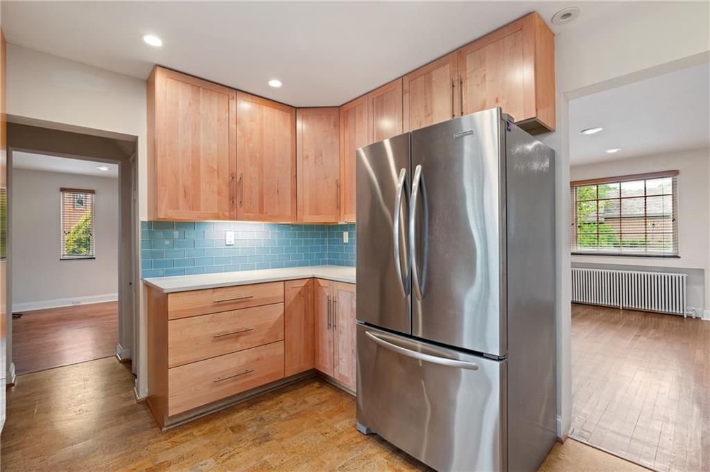 943 Wellesley Road Pittsburgh, PA 15206 - Photo 7 of 34 a kitchen with stainless steel appliances granite countertop a refrigerator and a stove