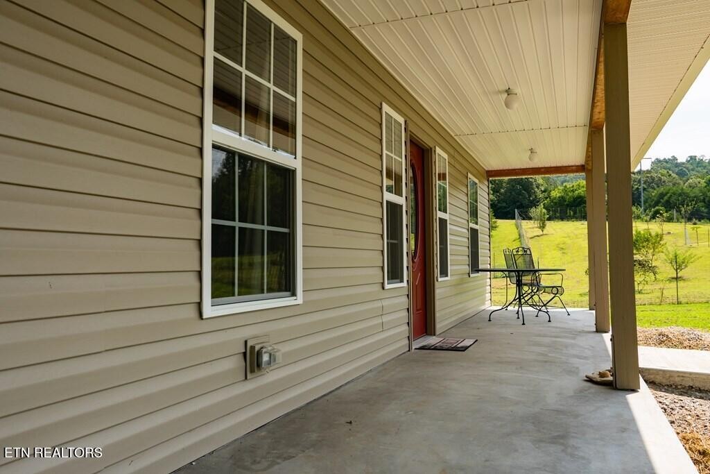 1518 Cummingsville And Sparkman Road Doyle, TN 38559 - Photo 42 of 58 a view of a house with a large window and wooden fence