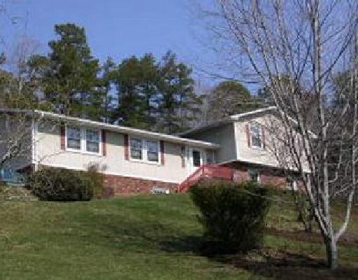 1334 Skyview Road Salem, VA 24153 - Photo 1 of 1 a front view of a house with a garden
