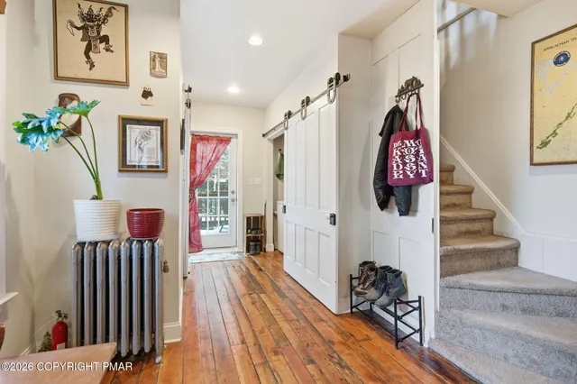 a view of a hallway with seating area