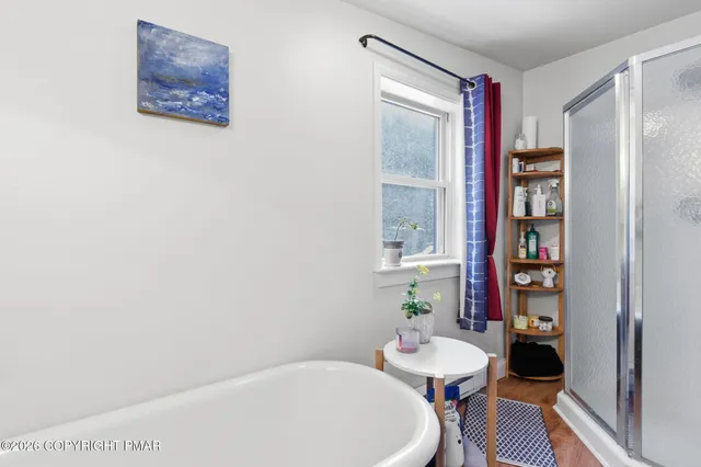 a bathroom with a bathtub and a toilet