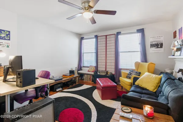 a bedroom with furniture and a window
