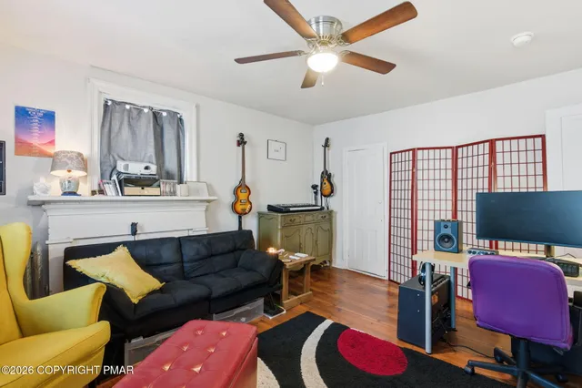 a living room with furniture and a flat screen tv