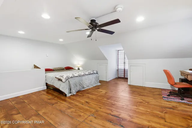 a bedroom with a bed and furniture