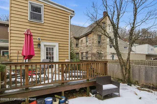a view of a balcony with furniture