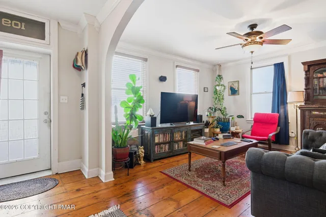 a living room with furniture and a flat screen tv