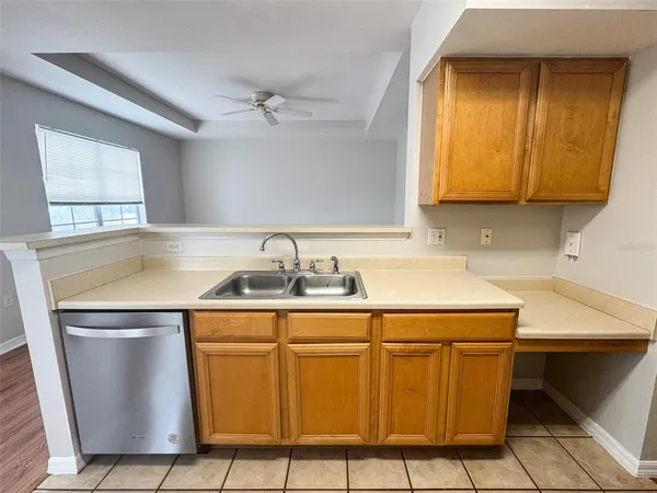 a room with a sink cabinets and utility room