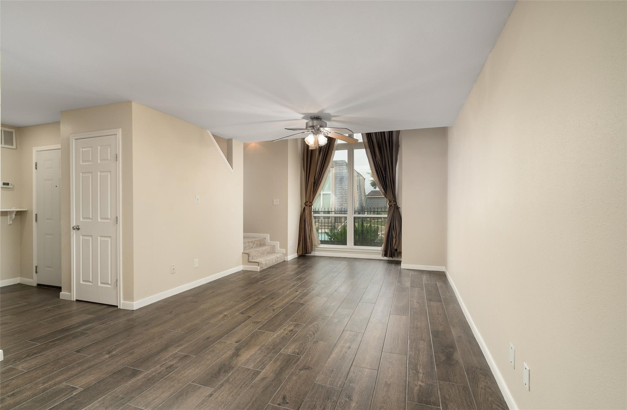 16120 Stuebner Airline Road, Unit 501 Spring, TX 77379 - Photo 13 of 23 an empty room with wooden floor and a window