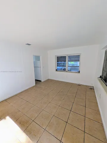 a view of an empty room and window